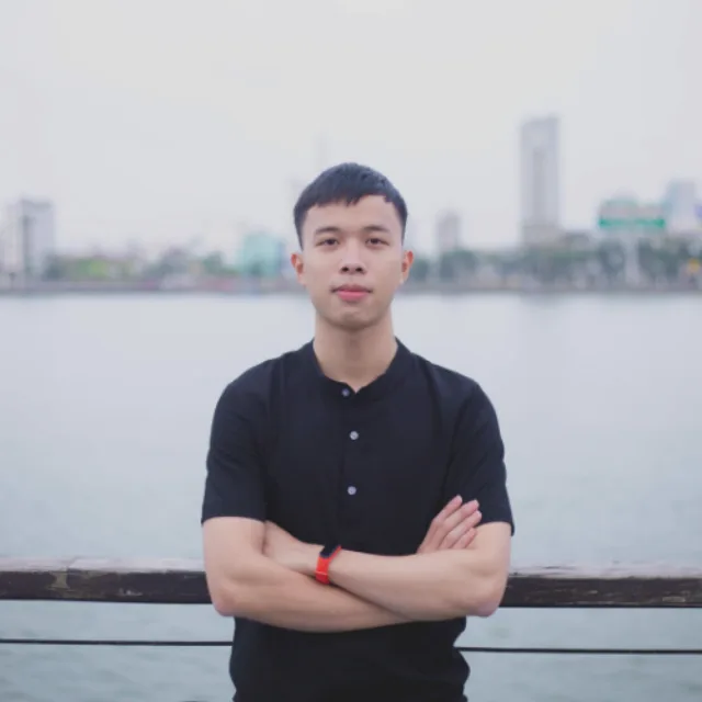 Ngo Van Dong standing by the Han River in Da Nang